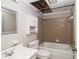Bathroom featuring a tiled shower and tub, vanity, and open ceiling at 60 Newton Ridge Dr, Covington, GA 30014
