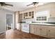 Classic kitchen with tile floors, white cabinets, and stainless steel appliances at 60 Newton Ridge Dr, Covington, GA 30014