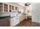 Classic kitchen with tile floors, white cabinets, and stainless steel appliances at 60 Newton Ridge Dr, Covington, GA 30014