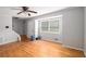 Bright living room featuring hardwood floors, large windows, and an open layout at 60 Newton Ridge Dr, Covington, GA 30014