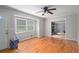 Bright living room featuring hardwood floors, large windows, and an open layout at 60 Newton Ridge Dr, Covington, GA 30014