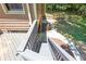 Backyard with stairs down to landscaped area, perfect for outdoor activities and enjoyment of nature at 10560 Haynes Bridge Rd, Alpharetta, GA 30022
