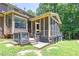 Exterior of home with deck overlooking a spacious backyard with mature trees at 10560 Haynes Bridge Rd, Alpharetta, GA 30022