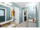 Bright bathroom featuring dual vanities with granite counters at 10560 Haynes Bridge Rd, Alpharetta, GA 30022