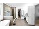 Bright bathroom features large walk-in shower, soaking tub, dual sinks, and access to a walk-in closet at 10560 Haynes Bridge Rd, Alpharetta, GA 30022