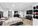 Finished basement bedroom with a dresser, queen bed, and ample space at 10560 Haynes Bridge Rd, Alpharetta, GA 30022