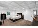 This bedroom offers great natural light, neutral decor and a decorative ceiling at 10560 Haynes Bridge Rd, Alpharetta, GA 30022