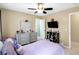 Bedroom with a comfortable bed, ceiling fan, and stylish dresser for a relaxing space at 10560 Haynes Bridge Rd, Alpharetta, GA 30022