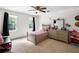 Bright bedroom with two windows, dresser, and natural light at 10560 Haynes Bridge Rd, Alpharetta, GA 30022