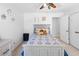 Bright bedroom featuring a bed with blue patterned linens and a ceiling fan with light at 10560 Haynes Bridge Rd, Alpharetta, GA 30022