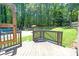 Deck leading to backyard and pool area, ideal for outdoor entertaining and relaxation at 10560 Haynes Bridge Rd, Alpharetta, GA 30022