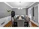 Beautiful dining room with hardwood floors and a large window offering natural light at 10560 Haynes Bridge Rd, Alpharetta, GA 30022