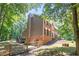 Exterior of a home with brick and vinyl siding, a deck, and a fenced yard at 10560 Haynes Bridge Rd, Alpharetta, GA 30022