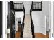 Inviting foyer with a grand staircase creates a memorable first impression at 10560 Haynes Bridge Rd, Alpharetta, GA 30022