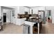 Bright kitchen featuring white cabinets, stainless appliances, and granite countertops at 10560 Haynes Bridge Rd, Alpharetta, GA 30022