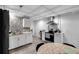 Cozy basement kitchen with modern appliances and white cabinetry at 10560 Haynes Bridge Rd, Alpharetta, GA 30022