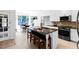 Modern eat-in kitchen with stainless steel appliances and a large island at 10560 Haynes Bridge Rd, Alpharetta, GA 30022