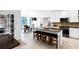 Open concept kitchen featuring a large island with seating, granite countertops, and stainless appliances at 10560 Haynes Bridge Rd, Alpharetta, GA 30022