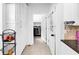 Laundry room with appliances and ample storage next to the kitchen at 10560 Haynes Bridge Rd, Alpharetta, GA 30022