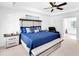 Bright primary bedroom with a decorative tray ceiling, accent seating, and a view of the ensuite bathroom at 10560 Haynes Bridge Rd, Alpharetta, GA 30022