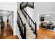 Staircase with carpeted steps and wooden banister leads to the upper level at 10560 Haynes Bridge Rd, Alpharetta, GA 30022