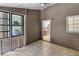 Enclosed sunroom featuring tile floor and view of kitchen, perfect for relaxing or entertaining at 10560 Haynes Bridge Rd, Alpharetta, GA 30022