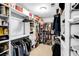 Custom walk-in closet with ample storage and organization for clothing and accessories at 10560 Haynes Bridge Rd, Alpharetta, GA 30022