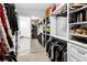 Custom walk-in closet with ample storage and organization for clothing and accessories at 10560 Haynes Bridge Rd, Alpharetta, GA 30022