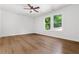 Bedroom with hardwood floors, natural light, ceiling fan, and clean white paint on walls at 2328 Lakewood Sw Ave, Atlanta, GA 30315