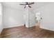 Bright bedroom features hardwood floors, a ceiling fan, and neutral walls, creating a serene and inviting atmosphere at 2328 Lakewood Sw Ave, Atlanta, GA 30315