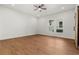Spacious bedroom featuring a ceiling fan, large window, and a rustic barn door at 2328 Lakewood Sw Ave, Atlanta, GA 30315