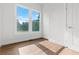 Bright bedroom featuring natural light and beautiful views from the large windows at 2328 Lakewood Sw Ave, Atlanta, GA 30315