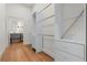 Walk-in closet with custom shelving and storage, leading to an ensuite bathroom at 2328 Lakewood Sw Ave, Atlanta, GA 30315