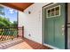 Stylish craftsman style front door with black accents and a charming wood porch at 2328 Lakewood Sw Ave, Atlanta, GA 30315