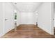 Spacious hallway featuring hardwood floors and multiple doorways, providing easy access to different areas of the home at 2328 Lakewood Sw Ave, Atlanta, GA 30315