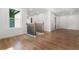 Bright hallway featuring beautiful wood floors, recessed lighting, natural light and dark metal railing at 2328 Lakewood Sw Ave, Atlanta, GA 30315