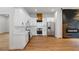 Spacious kitchen with white cabinets, stainless steel appliances, and stylish black accent wall at 2328 Lakewood Sw Ave, Atlanta, GA 30315
