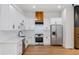 Modern kitchen with white cabinets, stainless steel appliances, and elegant countertops, perfect for cooking and entertaining at 2328 Lakewood Sw Ave, Atlanta, GA 30315