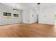 Bright and airy living room with hardwood floors, modern lighting, and large windows at 2328 Lakewood Sw Ave, Atlanta, GA 30315