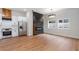 Modern living area featuring a black fireplace accent wall and stainless steel appliances at 2328 Lakewood Sw Ave, Atlanta, GA 30315