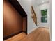 Bright stairway showcasing the wooden stairs, eye-catching wooden accent wall, and plenty of natural light at 2328 Lakewood Sw Ave, Atlanta, GA 30315
