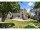 Large backyard with a patio, shed, and well-manicured lawn, ideal for outdoor activities at 424 Citronelle Dr, Woodstock, GA 30188