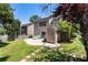 Spacious backyard featuring a patio, lush grass, storage shed and mature trees at 424 Citronelle Dr, Woodstock, GA 30188
