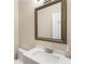 Bathroom featuring a vanity, sink, decorative mirror, and overhead lighting at 424 Citronelle Dr, Woodstock, GA 30188