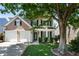 Inviting home with a well-manicured lawn, a two-car garage, and a classic architectural style at 424 Citronelle Dr, Woodstock, GA 30188
