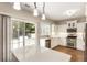 Well-lit kitchen with stainless appliances, a center island, and backyard access at 424 Citronelle Dr, Woodstock, GA 30188