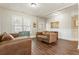 Inviting living room featuring hardwood floors, neutral decor, and abundant natural light at 424 Citronelle Dr, Woodstock, GA 30188