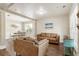 Open-concept living room with hardwood floors, a neutral color palette, and large windows for natural light at 424 Citronelle Dr, Woodstock, GA 30188