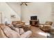 Cozy living room features a ceiling fan, wood floors, and comfortable seating at 424 Citronelle Dr, Woodstock, GA 30188