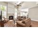 Spacious living room features a fireplace, wood floors, and backyard access at 424 Citronelle Dr, Woodstock, GA 30188